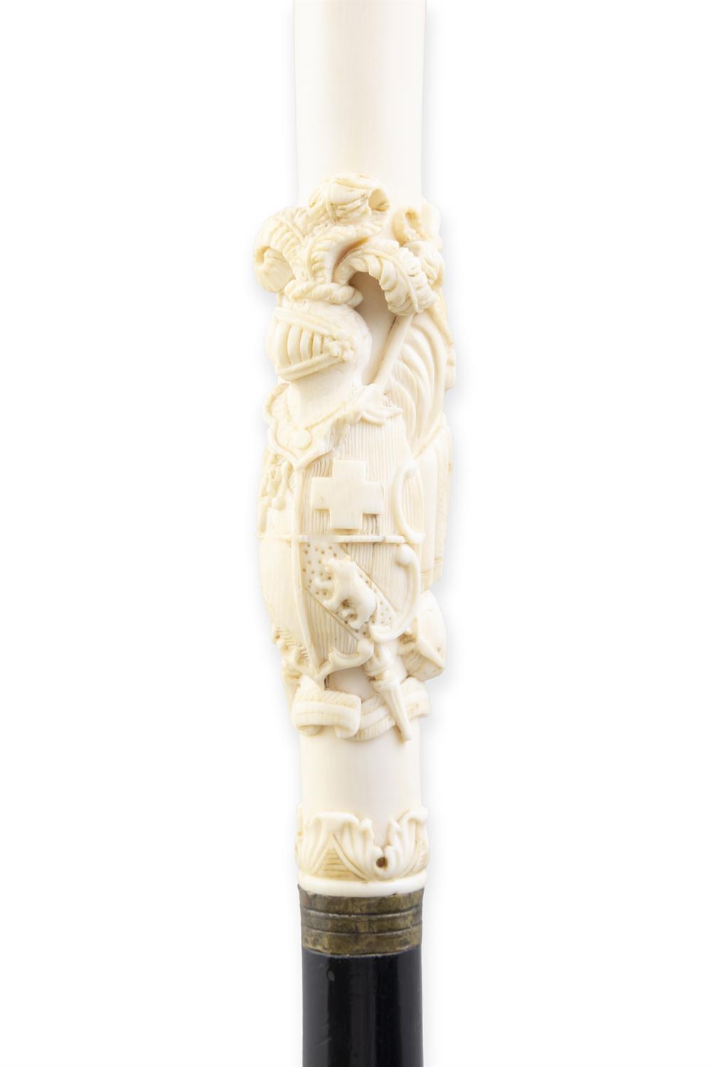 *A WALKING CANE, the ivory 'fist handle' top, with elaborately carved coat of arms, - Image 3 of 3