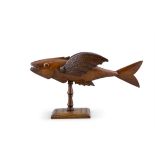 FRED CHRISTIAN Sculpture of a flying fish Wood, on turned column support and square base,