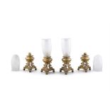 A SET OF FOUR ORMOLU LAMP BASES, 19TH CENTURY, on triple scroll dolphin supports,