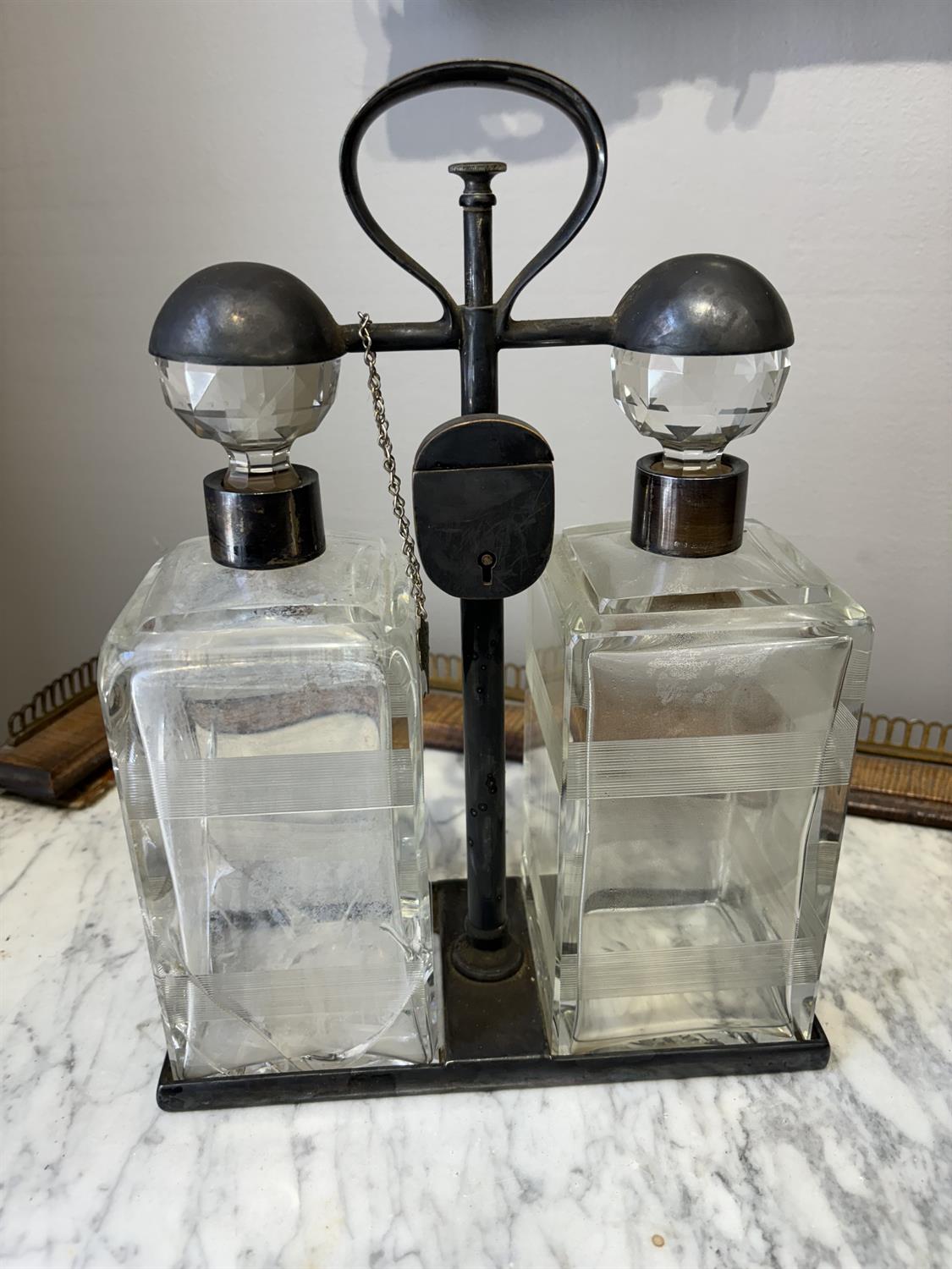 A PAIR OF SPIN TOP DOUBLE DECANTER TANTALUS BY HUKIN & HEATH each carrying frame with locking - Image 8 of 9