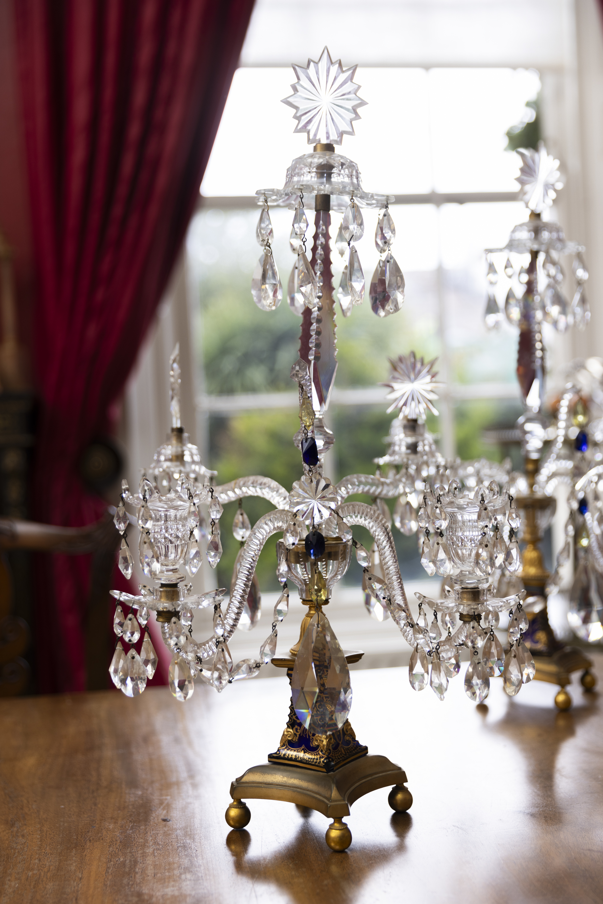 A PAIR OF GEORGE III ORMOLU CUT,GILDED AND BLUE GLASS TWO-LIGHT CANDELABRA, LATE 18TH CENTURY,