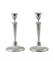 A PAIR OF GEORGE III SILVER CANDLESTICKS Sheffield, c.1785, mark of Luke Proctor & Co,