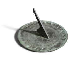 A VICTORIAN BRONZE CIRCULAR SUNDIAL the flattened panel engraved with an outer band of Roman