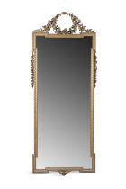 A GILTWOOD AND GESSO WALL MIRROR, 20TH CENTURY, the shaped plate within a beaded moulded and