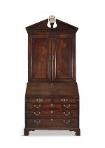 A FINE IRISH GEORGE III FIGURED MAHOGANY BLIND DOOR BUREAU BOOKCASE with an architectural