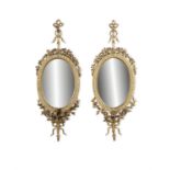A PAIR OF GILTWOOD CREAM PAINTED GIRANDOLE MIRRORS, 19TH CENTURY each with plain oval plate