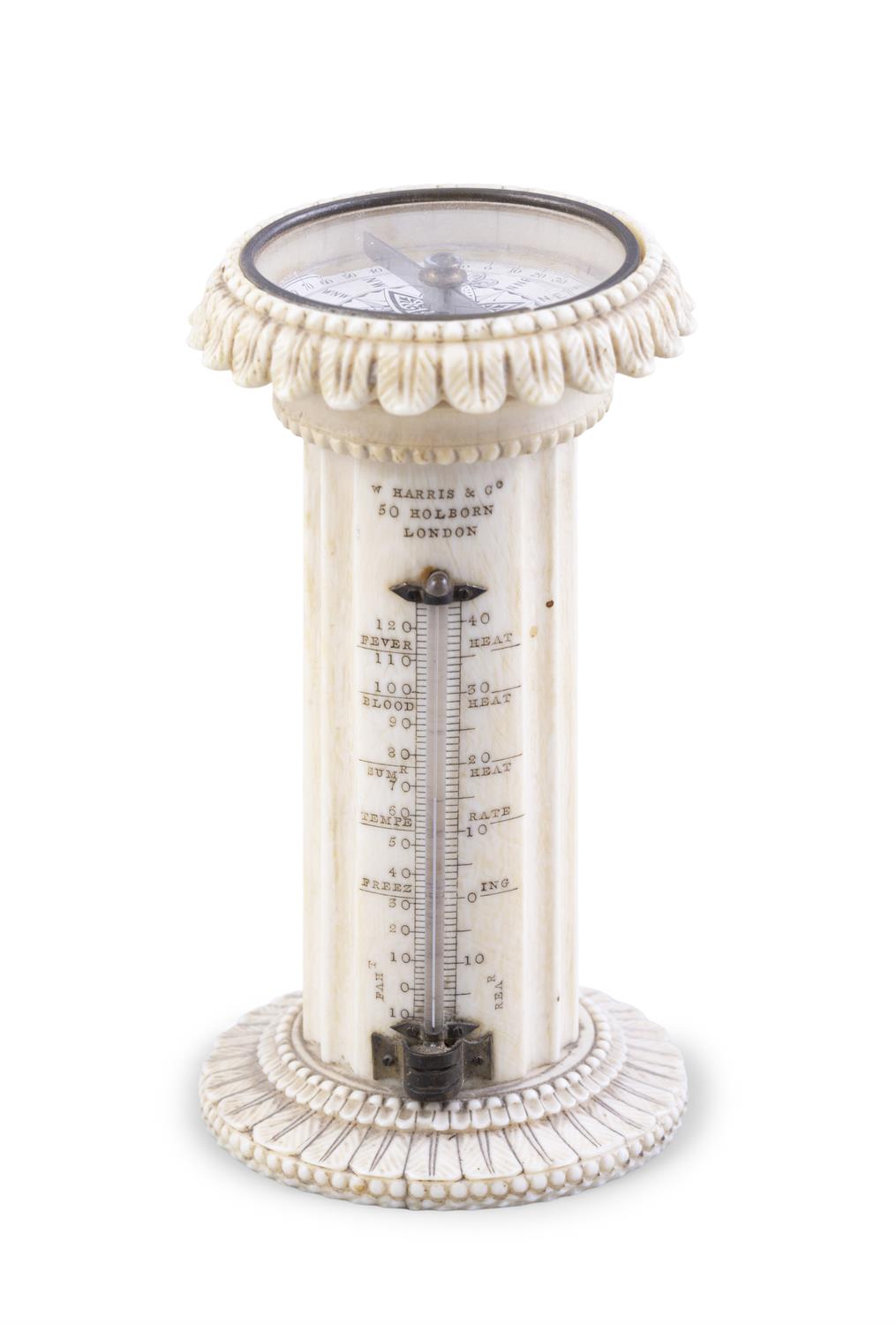 *AN IVORY PEDESTAL DESK THERMOMETER & COMPASS, BY HARRIS & CO, HOLBORN, LONDON in form of fluted