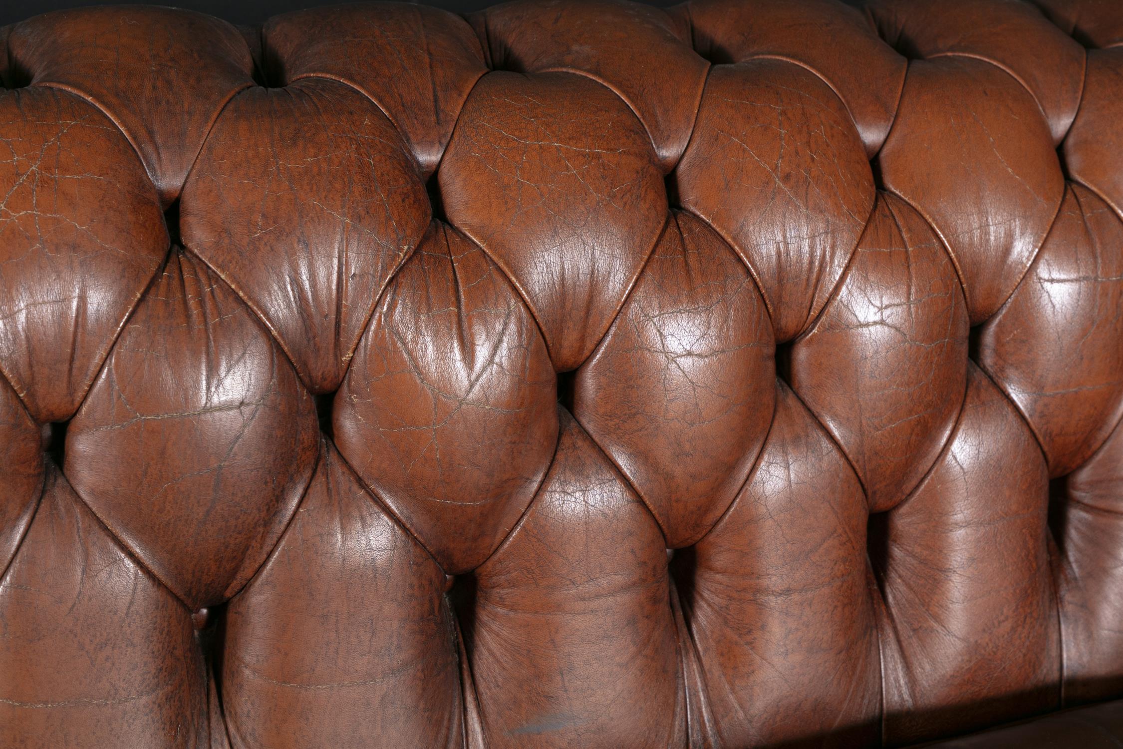 A CHESTERFIELD BUTTON BACK THREE SEATER SOFA, upholstered in brown leather with scroll-end - Image 4 of 18