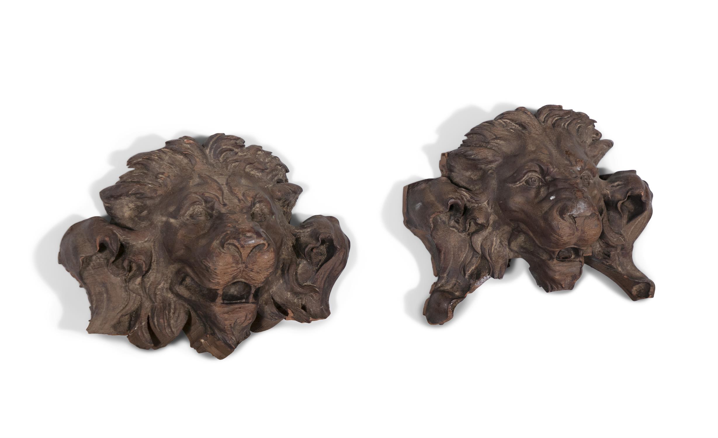 TWO CARVED WOOD LION MASK MOUNTS, 19TH CENTURY 25cm high, 30cm wide, 25cm deep