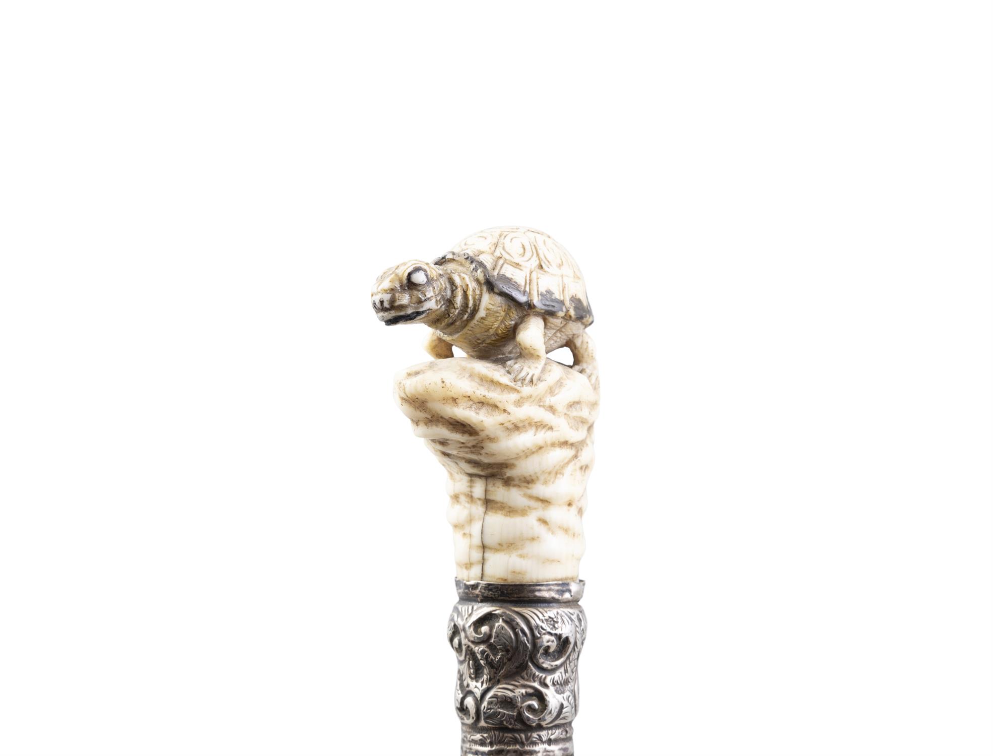 *A WALKING CANE, with a carved bone handle in the of a turtle perched on a rock above a white - Image 4 of 4