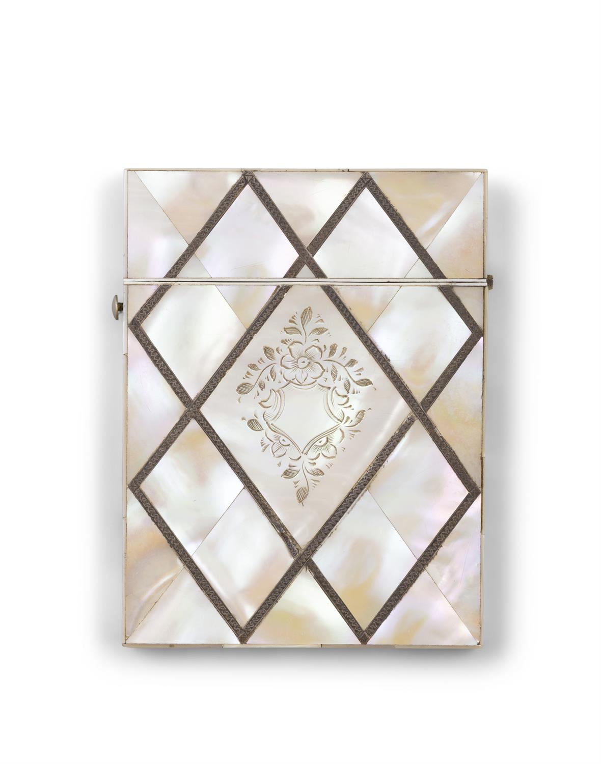 *A MOTHER OF PEARL CARD CASE with engraved floral design, applied metal work. 10.