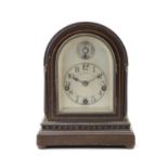 A STAINED BEECH MANTEL CLOCK, BY WINTERHALDER & HOFMEIER FOR J.E. CALDWELL & CO, PHILADELPHIA,