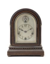 A STAINED BEECH MANTEL CLOCK, BY WINTERHALDER & HOFMEIER FOR J.E. CALDWELL & CO, PHILADELPHIA,