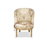 A LOUIS XVI CARVED GILTWOOD SMALL BERGERE, the silk upholstered back and arms with carved leaf