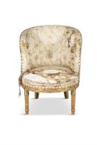 A LOUIS XVI CARVED GILTWOOD SMALL BERGERE, the silk upholstered back and arms with carved leaf