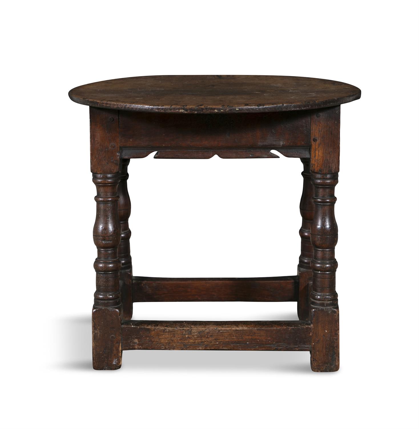 AN OAK JOINT STOOL, PENNSYLVANIA, LATE 17TH/EARLY 18TH CENTURY the circular top above a shaped