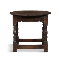 AN OAK JOINT STOOL, PENNSYLVANIA, LATE 17TH/EARLY 18TH CENTURY the circular top above a shaped