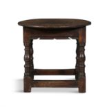 AN OAK JOINT STOOL, PENNSYLVANIA, LATE 17TH/EARLY 18TH CENTURY the circular top above a shaped