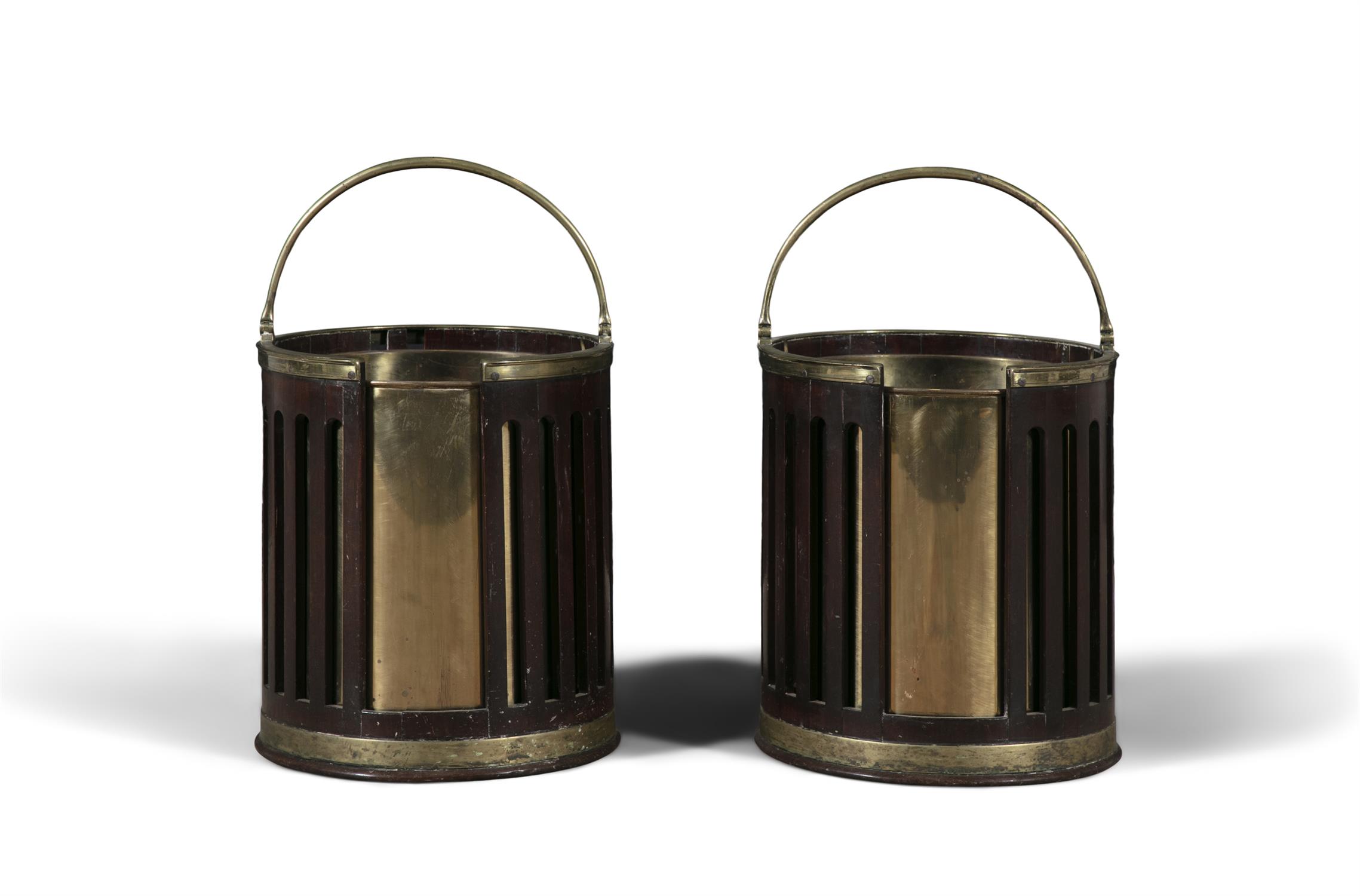 A PAIR OF GEORGE III MAHOGANY AND BRASS BOUND PLATE BUCKETS with arched swing handle and