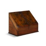 A MAHOGANY SLOPEFRONT DESK ORGANISER, enclosing a fitted interior. 30 cm high, 38.5 cm wide,