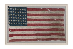 A FOURTY-EIGHT STAR AMERICA FLAG, EARLY 20TH CENTURY dyed linen laid down on board, framed. 68.