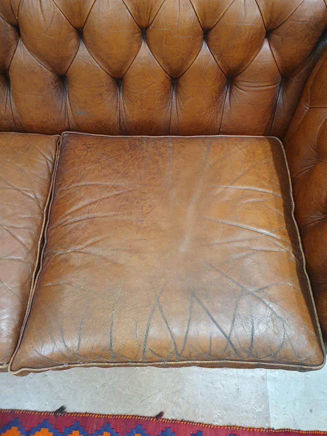 A CHESTERFIELD BUTTON BACK THREE SEATER SOFA, upholstered in brown leather with scroll-end - Image 10 of 18