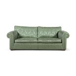 A LARGE DOUBLE SCROLL-END THREE SEAT SETTEE, 20TH CENTURY covered in a pale green foliate damask,