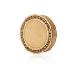 A FRENCH GOLD SNUFF BOX of circular form, the rim with foliate scroll decoration,