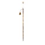 *A WALKING CANE, 19TH CENTURY with gilt metal top, inscribed with crest, with ivory and faux
