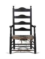 AN EBONISED WINDSOR ARMCHAIR, PENNSYLVANIA LATE 18TH CENTURY humpback back splats flanked by