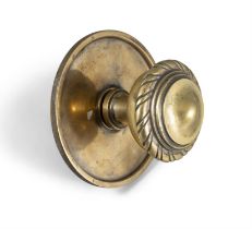 A LARGE GEORGIAN STYLE DOOR KNOB 15cm diameter; together with a smaller brass door knob (2)