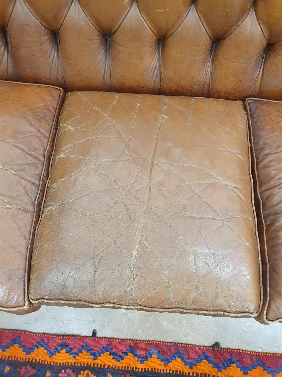A CHESTERFIELD BUTTON BACK THREE SEATER SOFA, upholstered in brown leather with scroll-end - Image 9 of 18