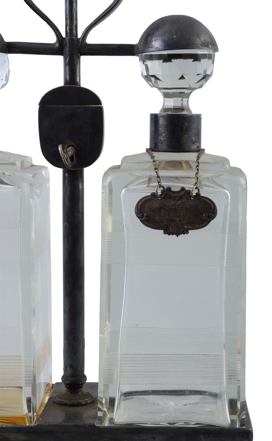 A PAIR OF SPIN TOP DOUBLE DECANTER TANTALUS BY HUKIN & HEATH each carrying frame with locking - Image 2 of 9