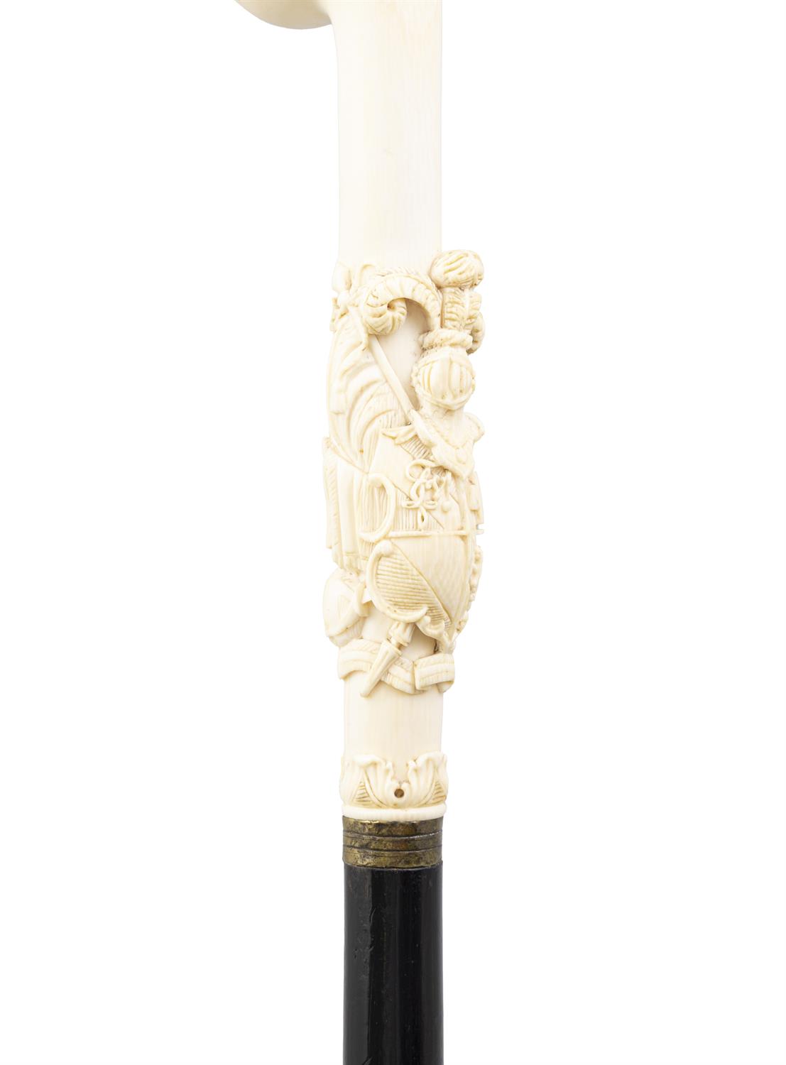 *A WALKING CANE, the ivory 'fist handle' top, with elaborately carved coat of arms, - Image 2 of 3