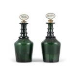 A PAIR OF BRISTOL GREEN GLASS DECANTERS, EARLY 19TH CENTURY, with triple faceted neck rims,