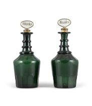 A PAIR OF BRISTOL GREEN GLASS DECANTERS, EARLY 19TH CENTURY, with triple faceted neck rims,