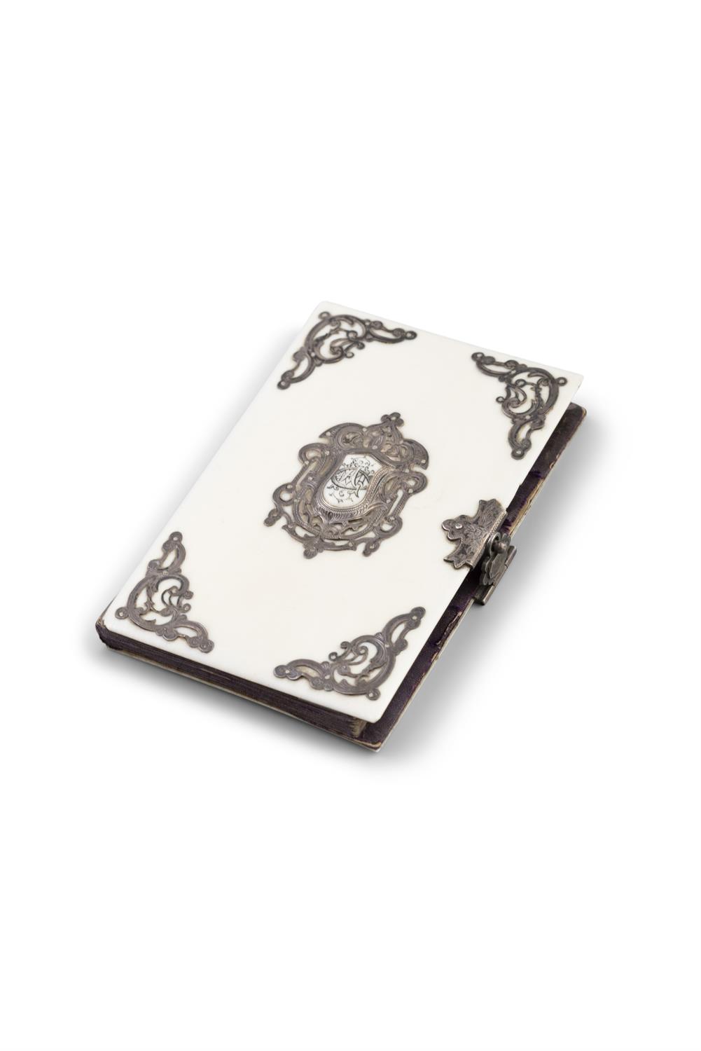 *AN IVORY CARD CASE, with applied metal scrollwork mounts, with crest reserve to centre,