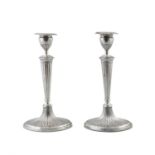 A PAIR OF GEORGE III SILVER CANDLESTICKS Sheffield, c.1785, mark of Luke Proctor & Co,