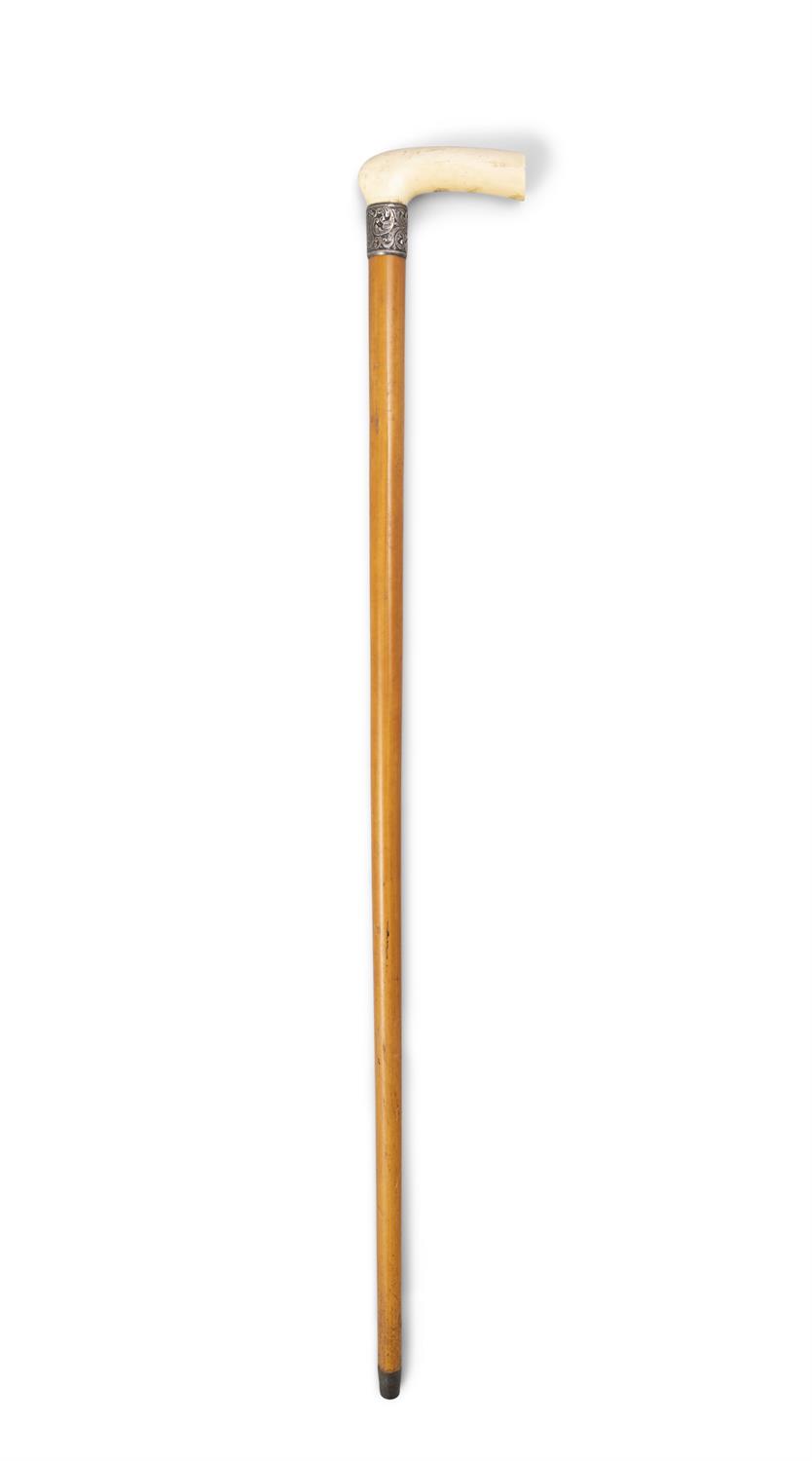 *A WALKING CANE, 19TH CENTURY with a plain ivory handle and silver collar, Birmingham, mark J H,