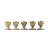 A SET OF FIVE GEORGE III SILVER GILT EGGS CUPS, London c.1810, maker's mark of Elizabeth Morley,