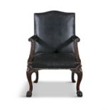 A GEORGE III 'GAINSBOROUGH' LIBRARY ARMCHAIR, upholstered in black leather, with out scrolling