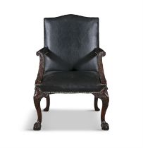 A GEORGE III 'GAINSBOROUGH' LIBRARY ARMCHAIR, upholstered in black leather, with out scrolling