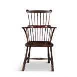 AN ELM COMB-BACK WINDSOR CHAIR, PHILADELPHIA LATE 18TH/EARLY 19TH CENTURY shaped top rail above