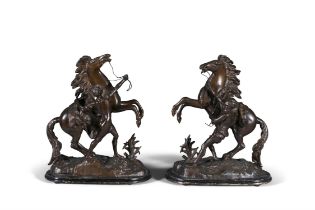 AFTER COUSTEAU, circa 1900, a pair of bronzed metal Marley horses, modelled as an attendant