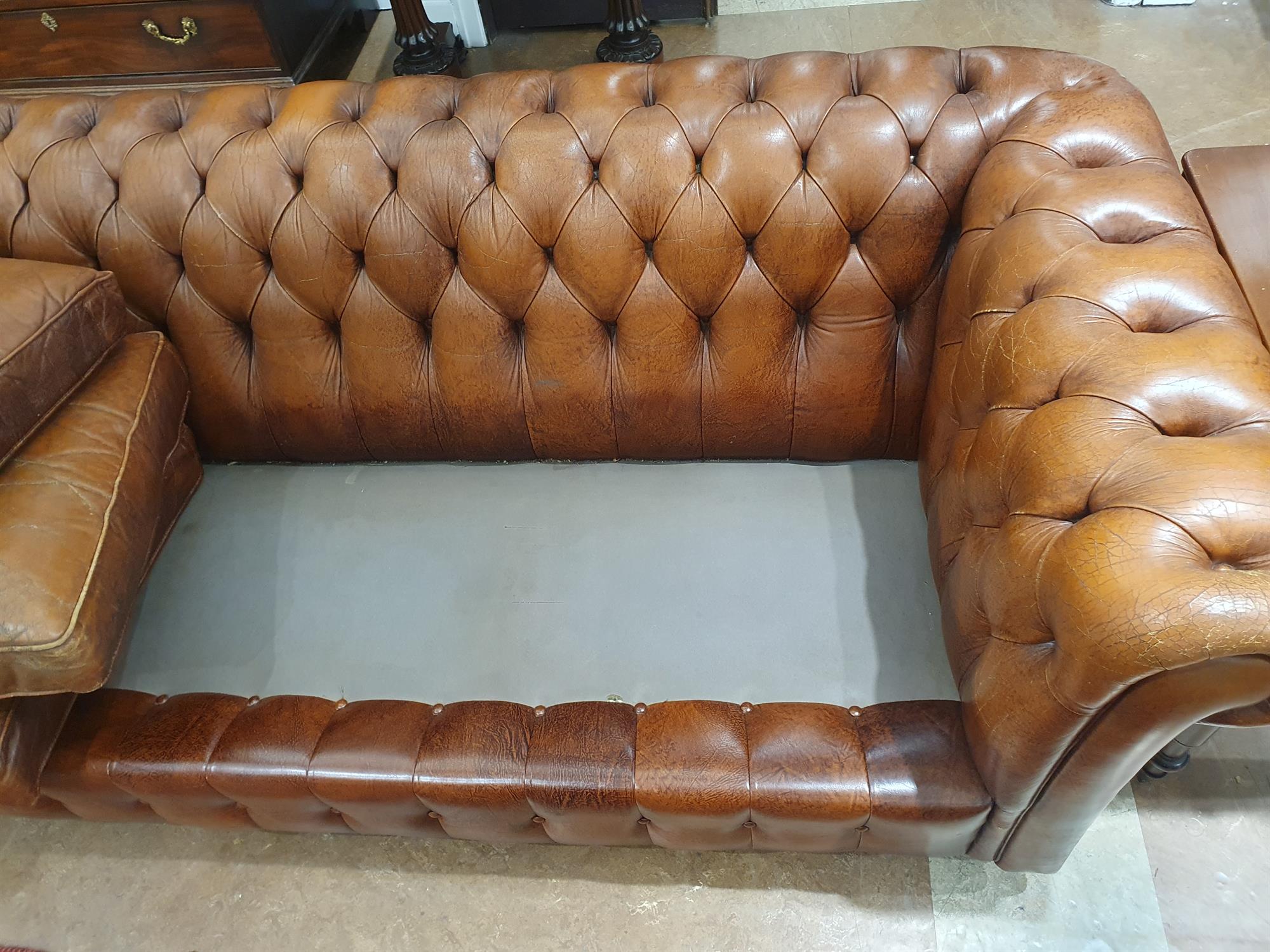 A CHESTERFIELD BUTTON BACK THREE SEATER SOFA, upholstered in brown leather with scroll-end - Image 17 of 18