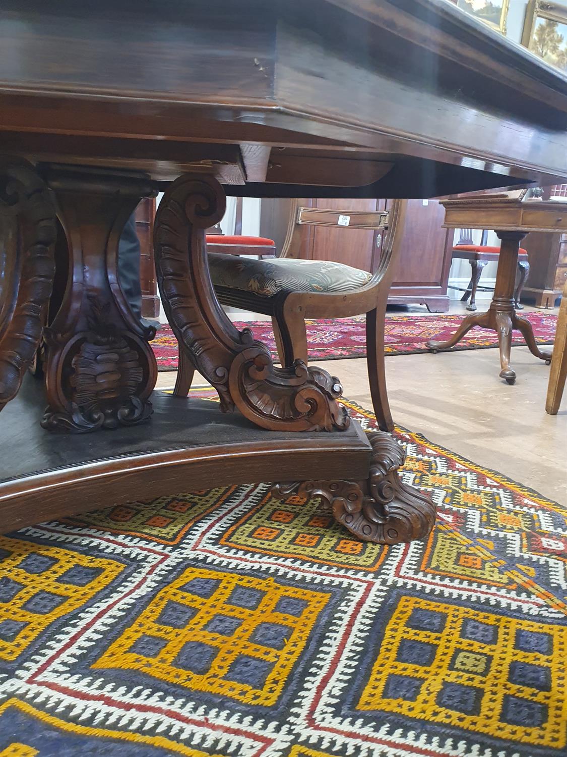 A VICTORIAN ROSEWOOD OCTAGONAL BREAKFAST TABLE, with stepped moulded rim, on carved scroll - Image 7 of 14