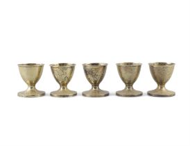 A SET OF FIVE GEORGE III SILVER GILT EGGS CUPS, London c.1810, maker's mark of Elizabeth Morley,