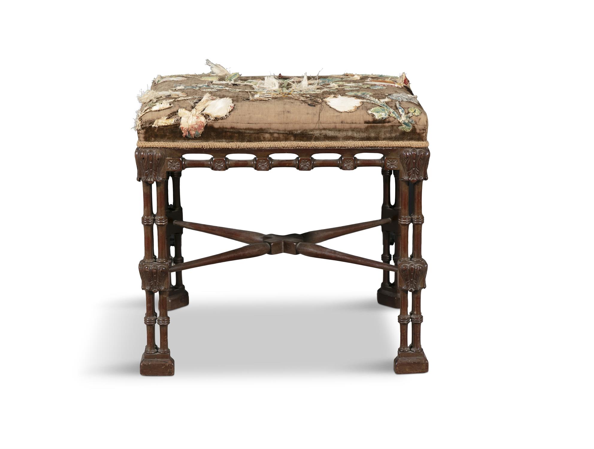 A "CHINESE CHIPPENDALE" UPHOLSTERED MAHOGANY STOOL, 19TH CENTURY with intricately carved