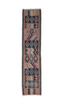 A FLAT-WOVEN KILIM RUNNER, CA. 1940s, 238 x 56cm the central reserve woven with thirteen rows of