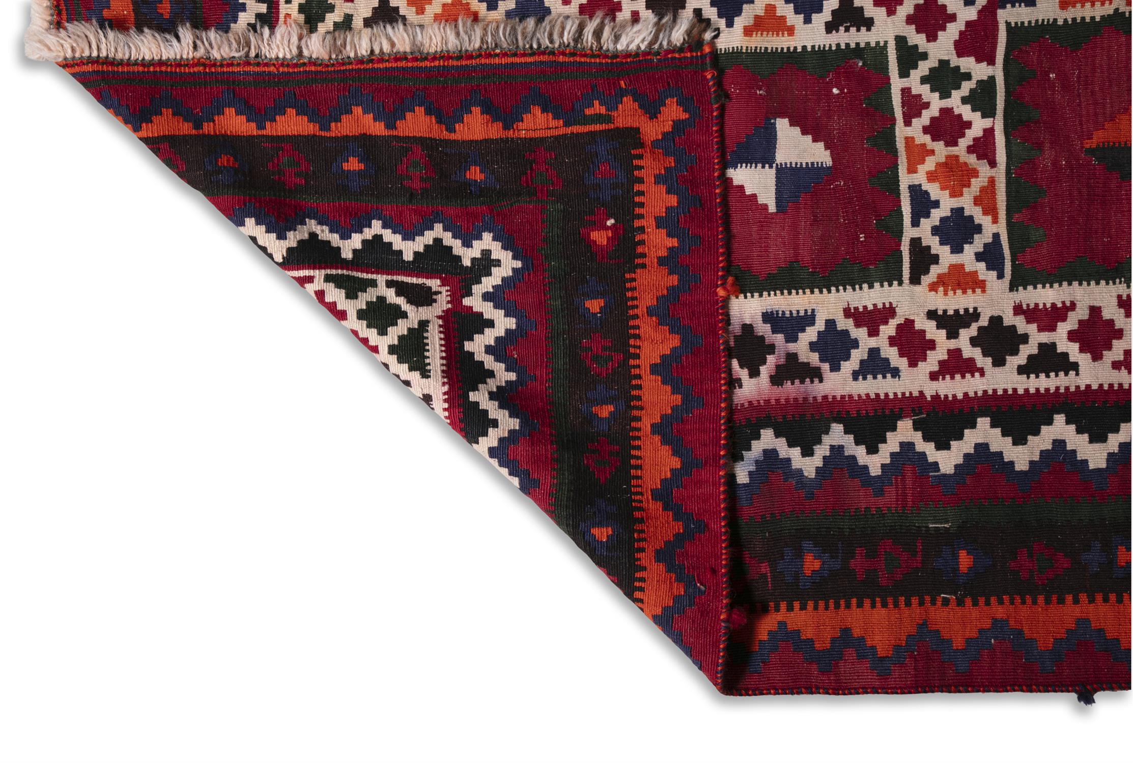 AN IRANIAN RED GROUND WOOL RUG, CA 1940s, 288 x 168cm the central field woven with three rows of - Image 2 of 4